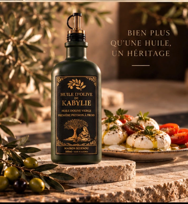Bouteille d'huile d'olive de Kabylie servie avec une burrata et des tomates